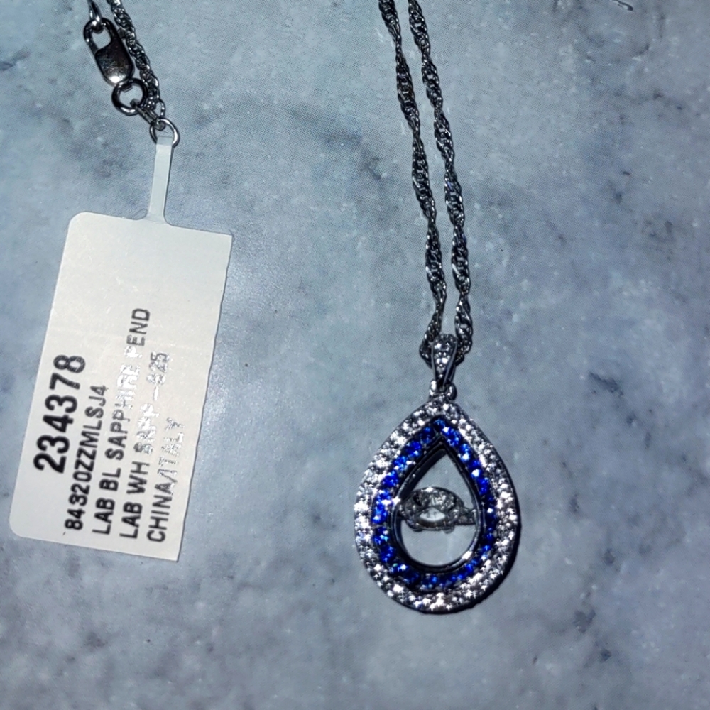 Sterling silver necklace and sterling silver charm with moving pendant